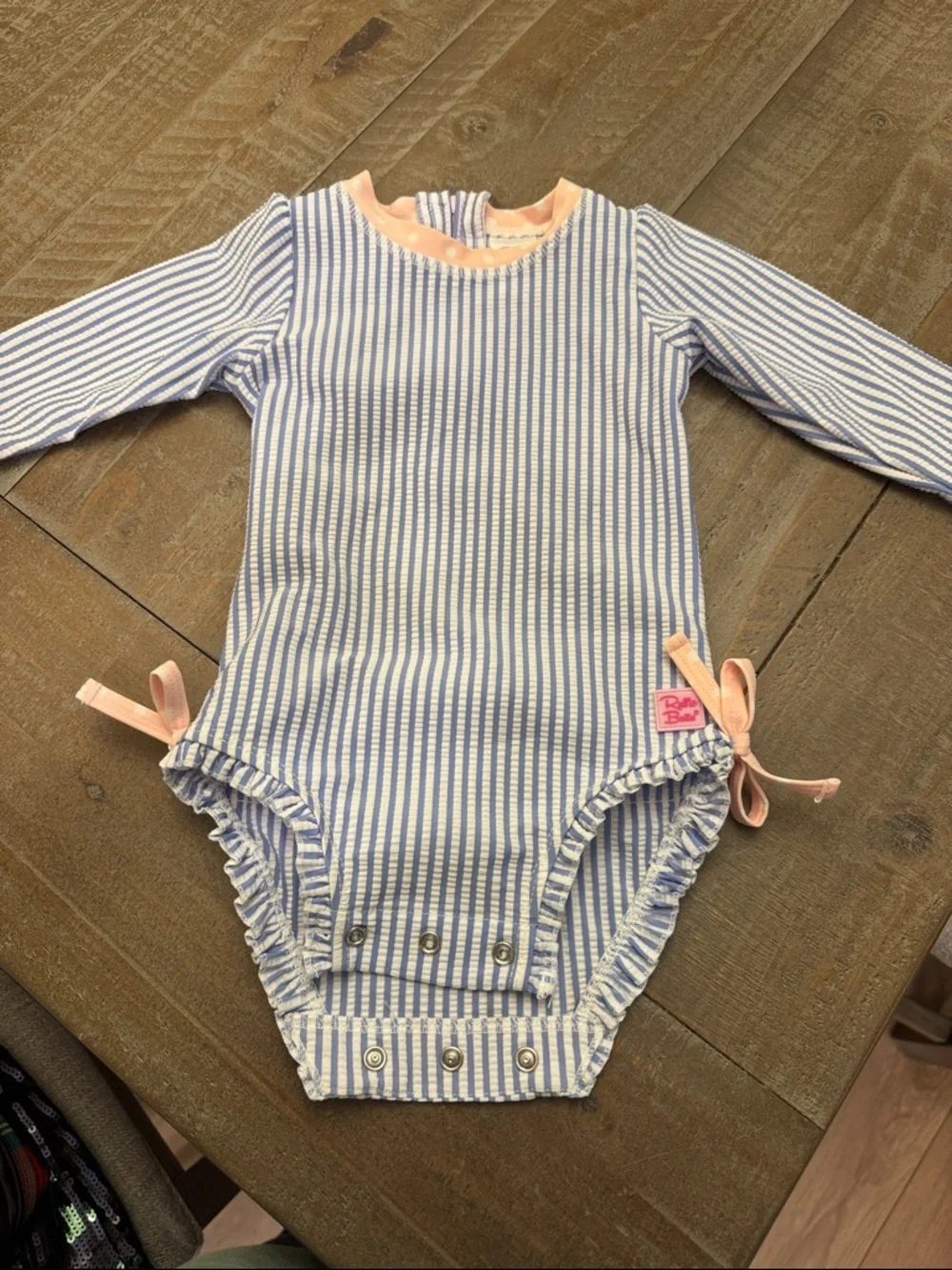 RUFFLE BUTTS NWOT Stripped Seersucker Ruffle Long Sleeve Rash Guard Swimsuit